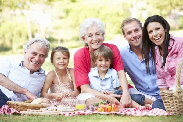 Family with grandchildren receiving guidance on wealth transfer strategies.